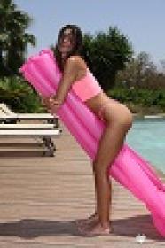 Gorgeous Melena Tara Poses Poolside In A Pink Bikini & Gets Her Hot Body Wet